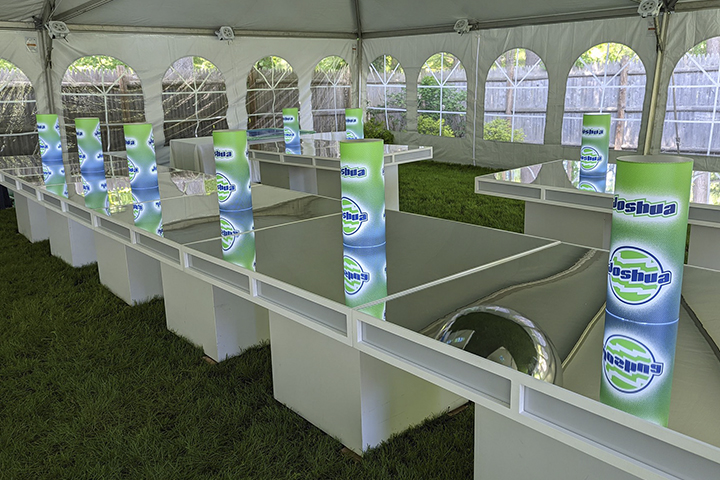 Illuminated centerpieces inside a tented event